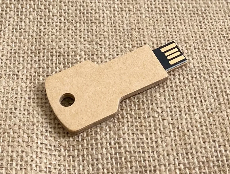 A key shaped usb drive made from 100% recyclable cardboard material which can have your logo printed on it.